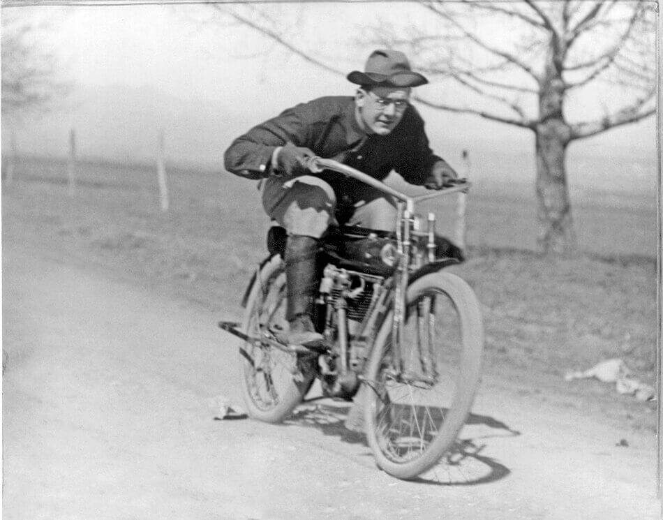 Laurence B. Flanders Sr. on his motorbike, 1914